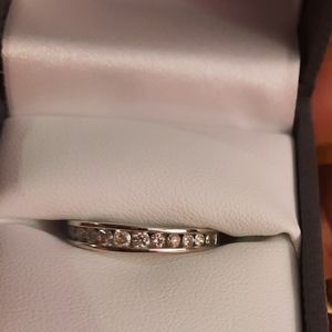 Authentic 1/2 carat 10k white gold band.